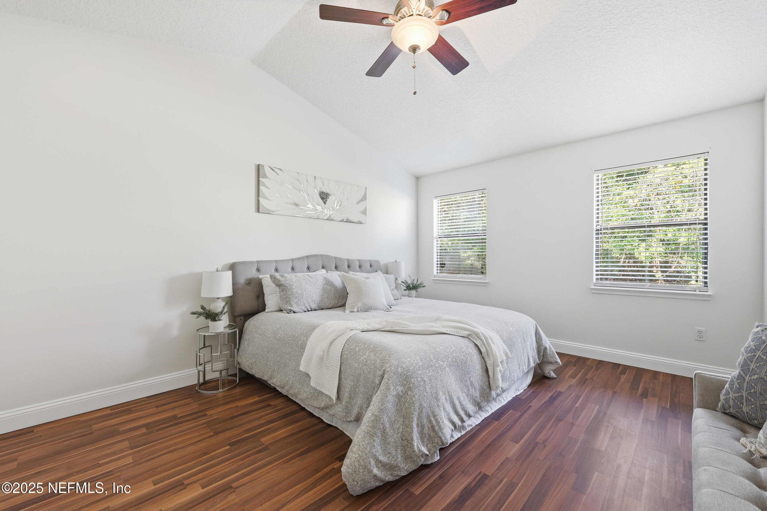 1626 Sandy Hollow Loop Middleburg, FL 32068 - Photo 17 of 40 a bedroom with a bed and wooden floor