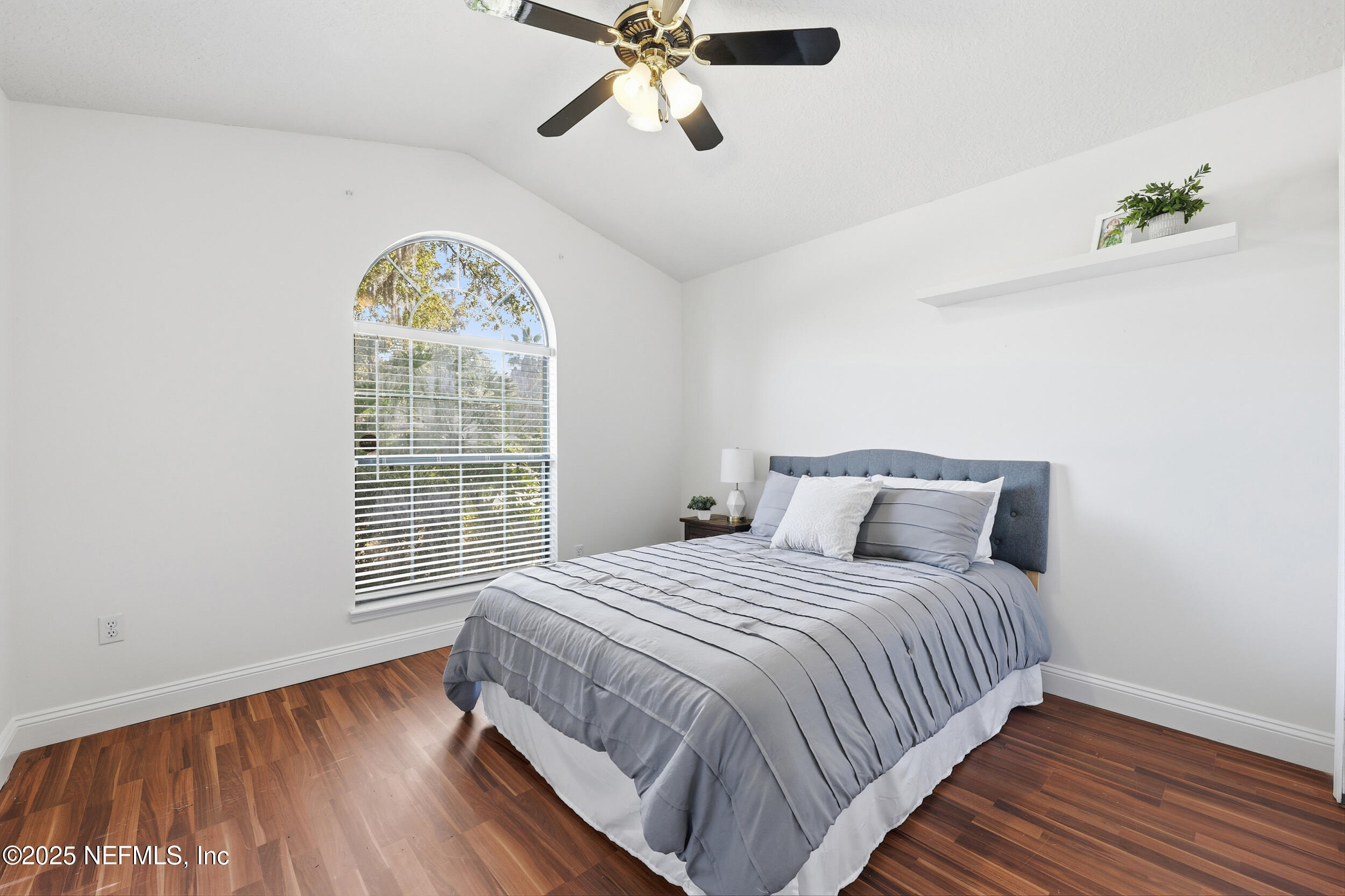 1626 Sandy Hollow Loop Middleburg, FL 32068 - Photo 21 of 40 a bedroom with a bed and a window