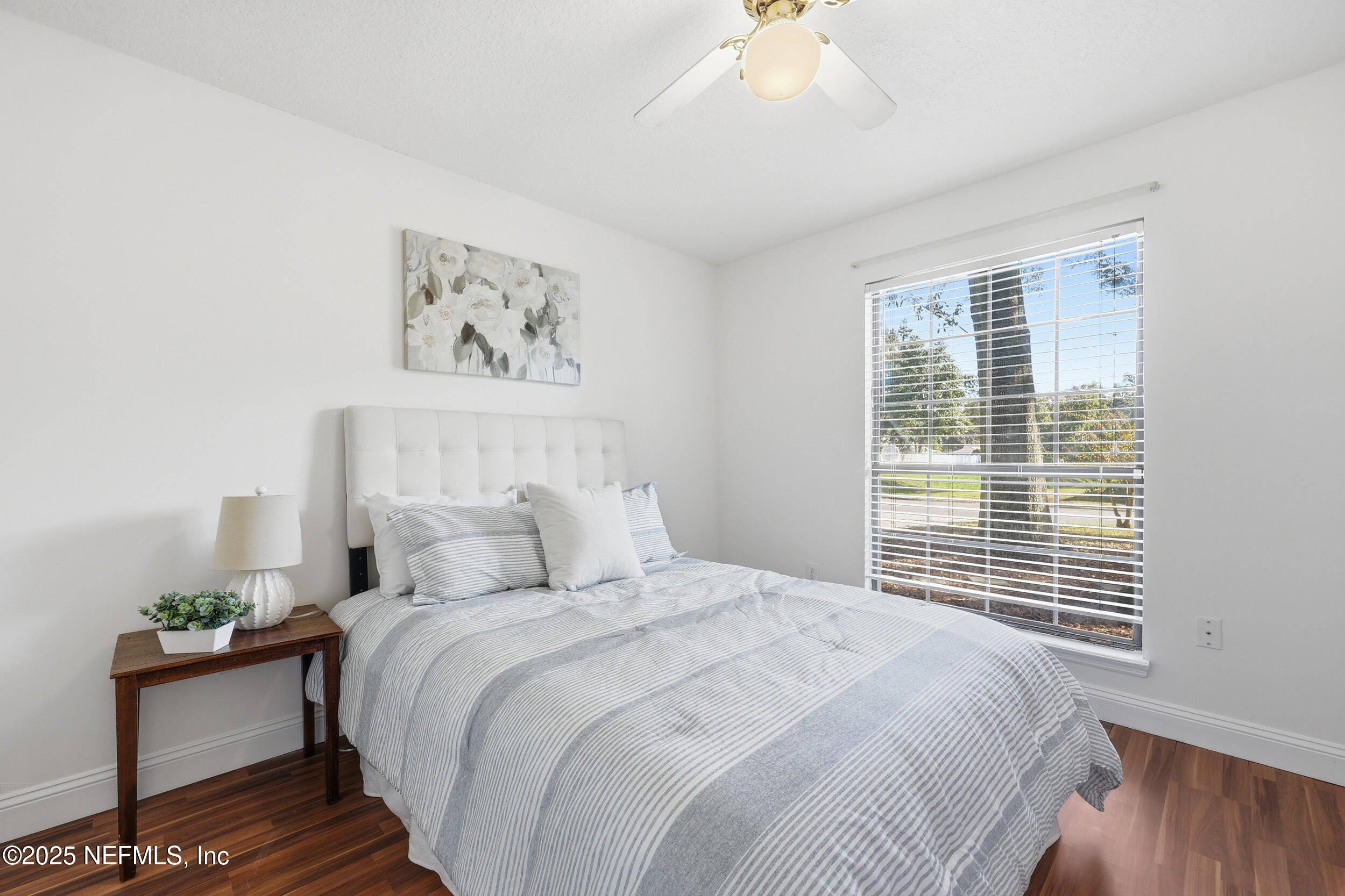 1626 Sandy Hollow Loop Middleburg, FL 32068 - Photo 24 of 40 a bedroom with a large bed and a window