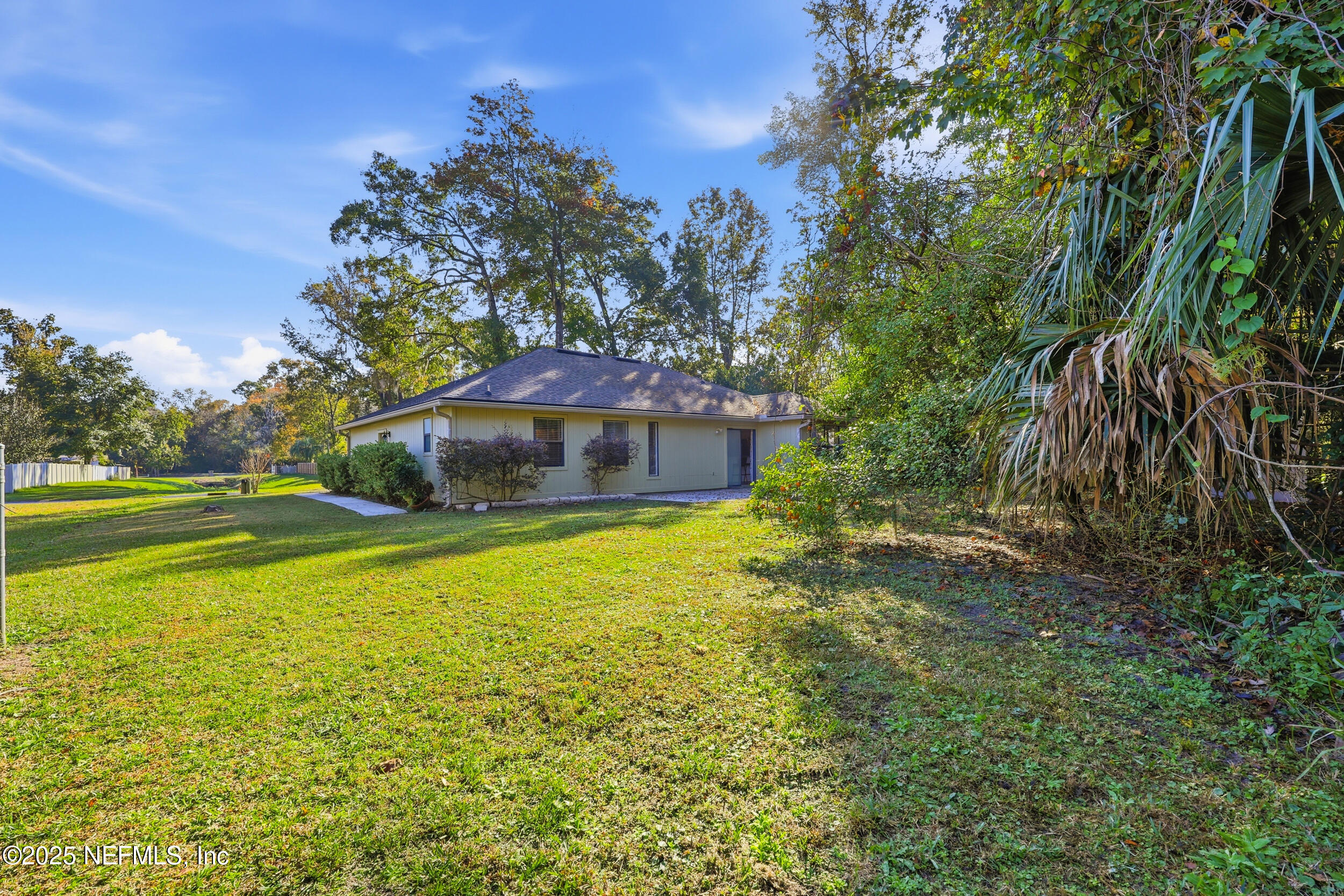 1626 Sandy Hollow Loop Middleburg, FL 32068 - Photo 36 of 40 a yellow building in the middle of a yard