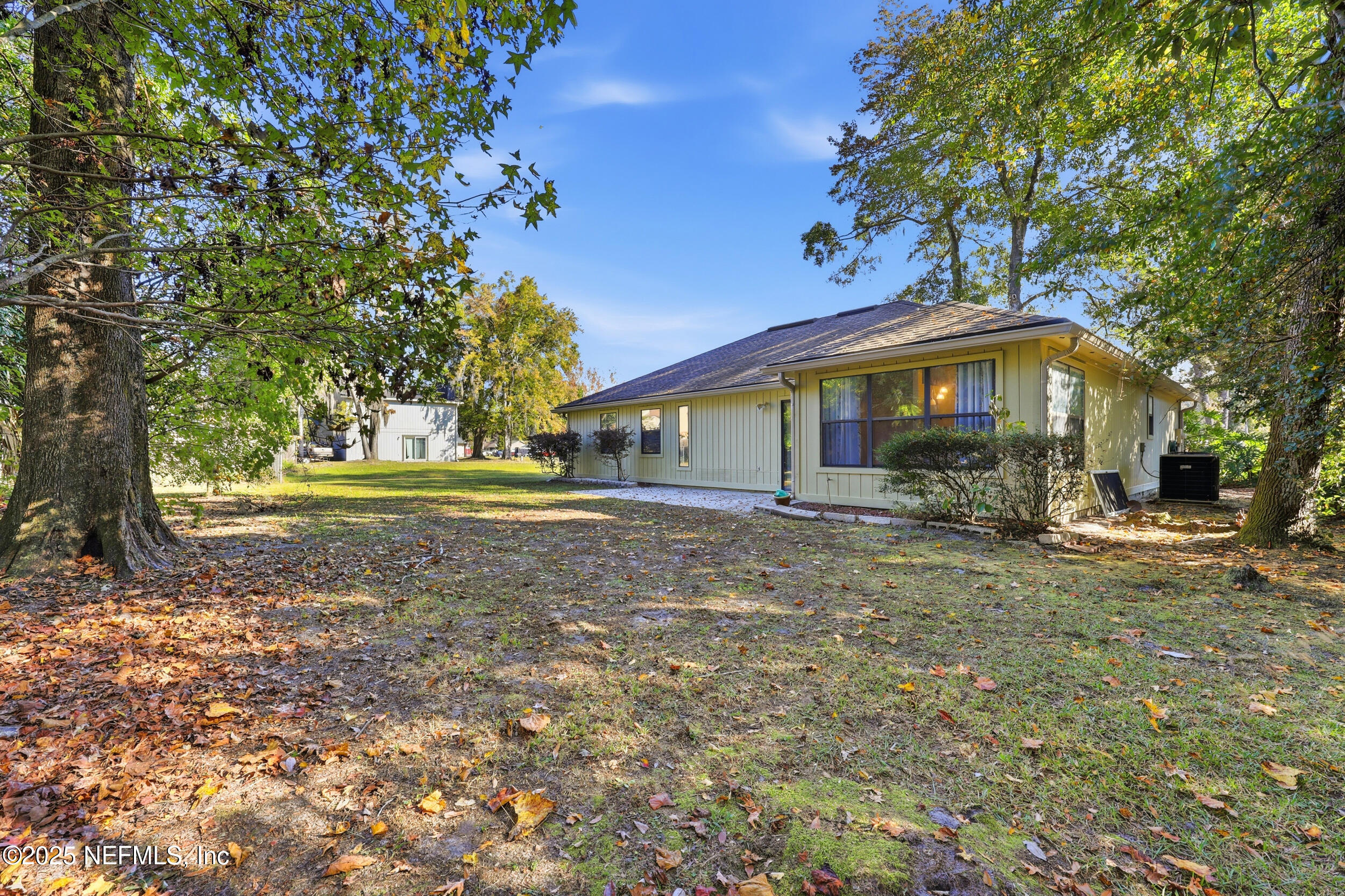 1626 Sandy Hollow Loop Middleburg, FL 32068 - Photo 4 of 40 a front view of a house with a yard