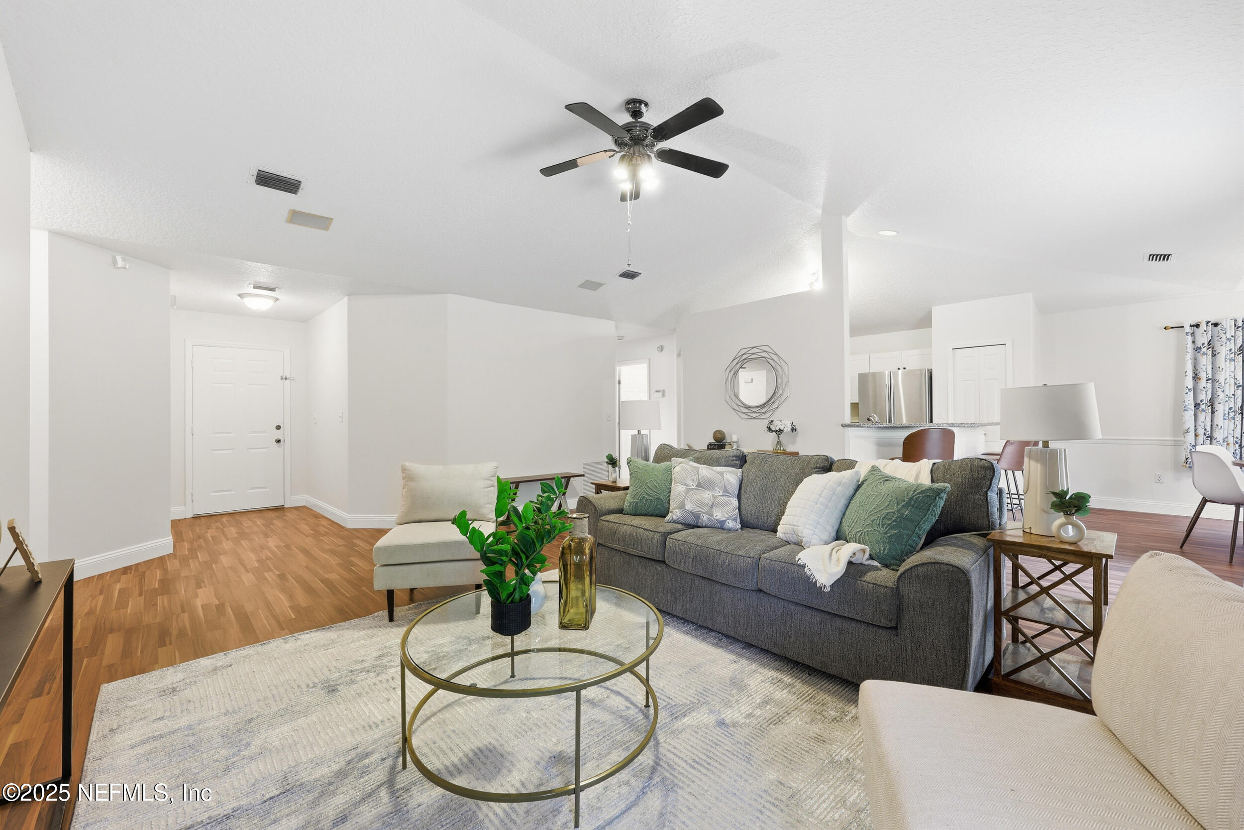 1626 Sandy Hollow Loop Middleburg, FL 32068 - Photo 8 of 40 a living room with furniture potted plant and a ceiling fan