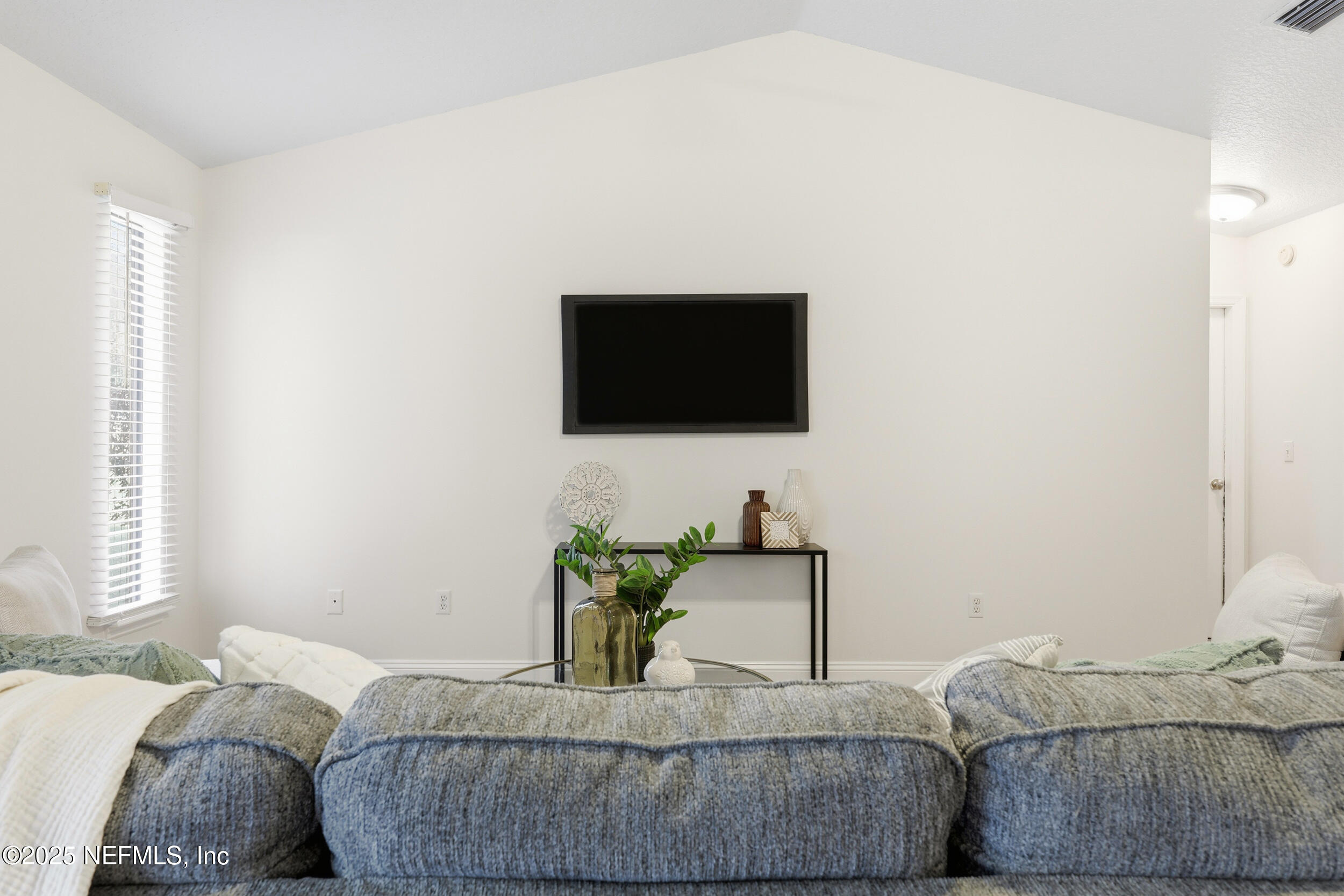 1626 Sandy Hollow Loop Middleburg, FL 32068 - Photo 10 of 40 a living room with furniture and a flat screen tv