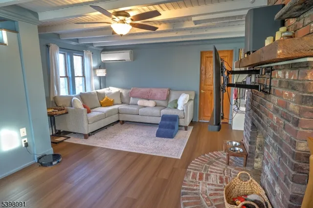 a living room with furniture and a rug