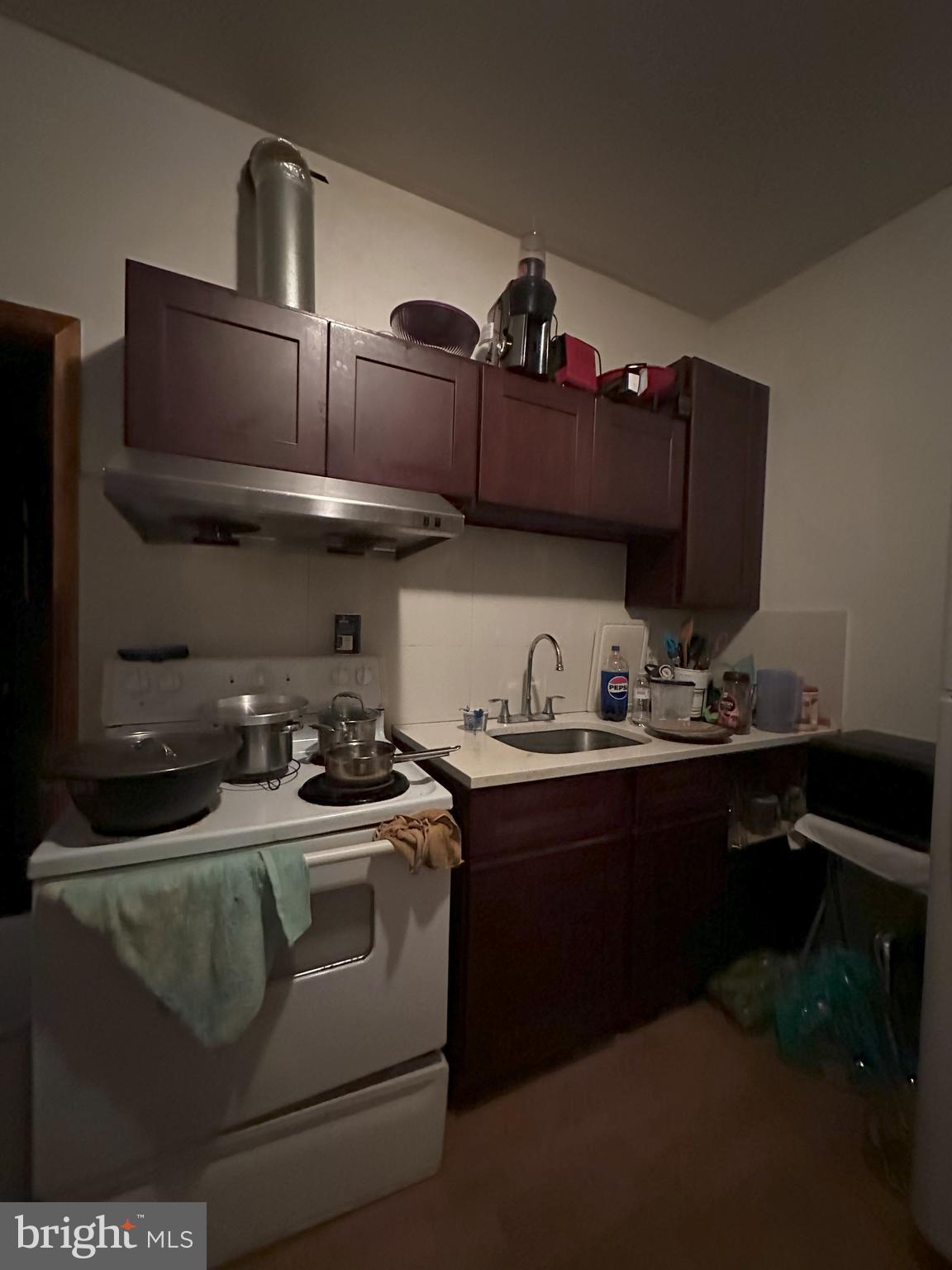 2014 South 7th Street Philadelphia, PA 19148 - Photo 15 of 23 a kitchen with a stove and cabinets