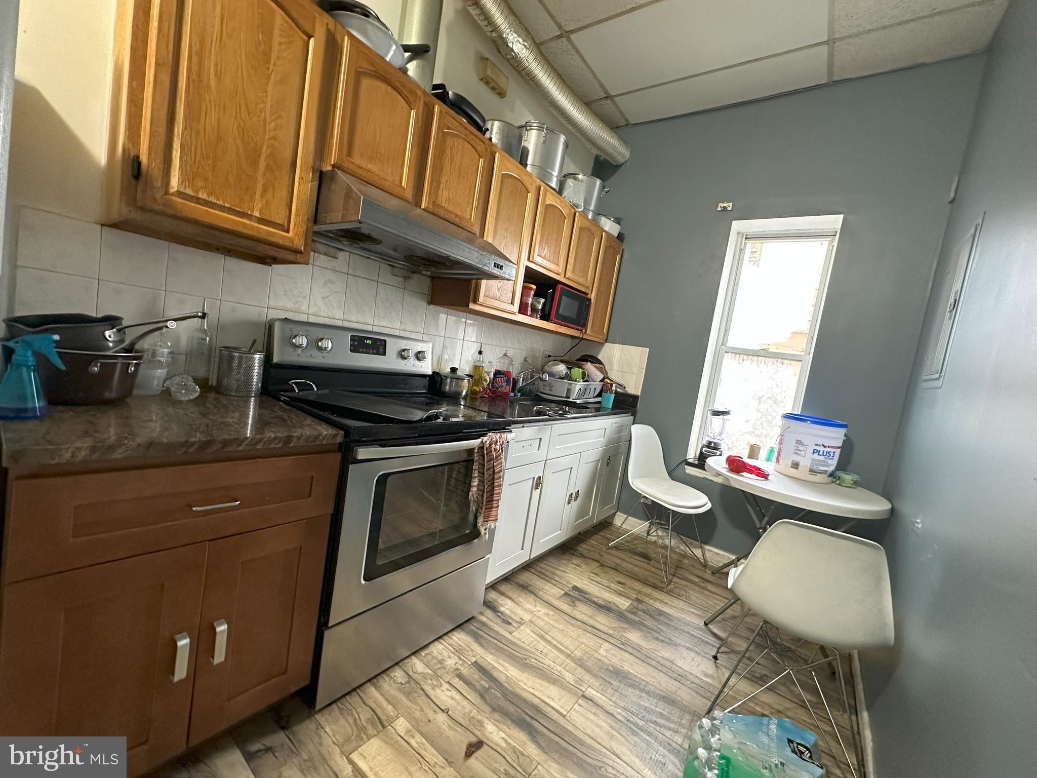 2014 South 7th Street Philadelphia, PA 19148 - Photo 21 of 23 a kitchen with stainless steel appliances granite countertop a stove a sink and a microwave