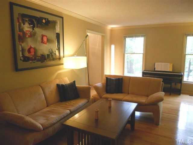 Clean lines and wood floors give Living Room a spacious feeling.