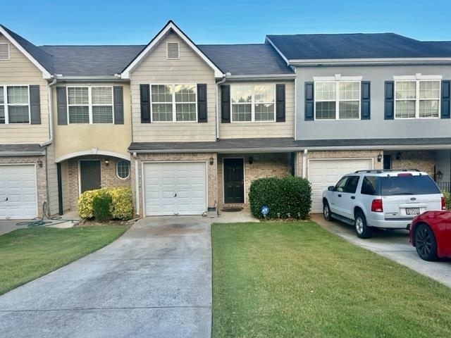 639 Georgetown Court Jonesboro, GA 30236 - Photo 1 of 1 a front view of a house with a yard