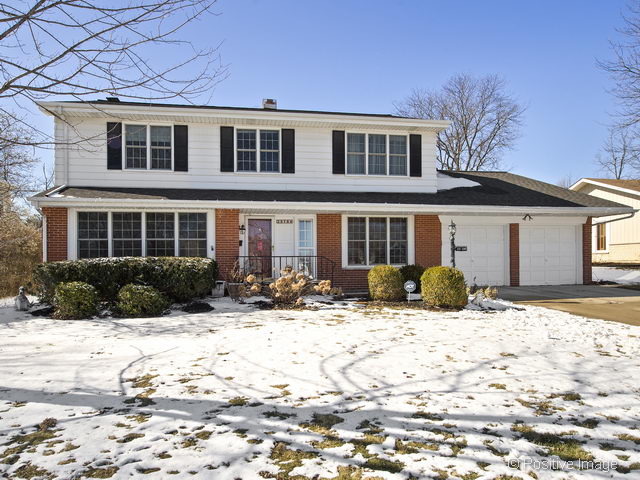 2S184 Sheffield Road Glen Ellyn, IL 60137 - Photo 1 of 25 a front view of a house with a yard