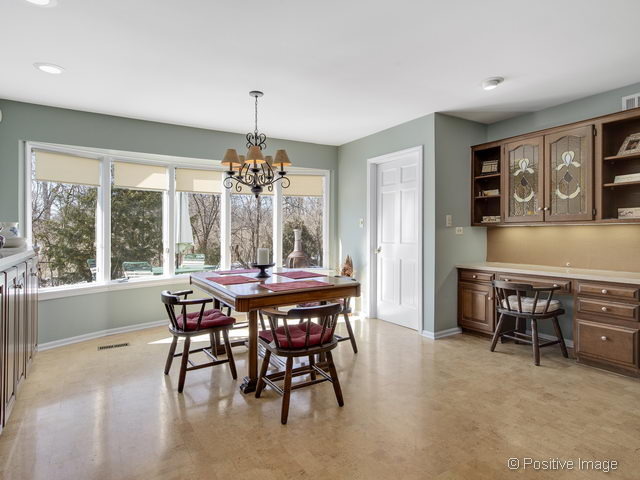 2S184 Sheffield Road Glen Ellyn, IL 60137 - Photo 12 of 25 a dining room with furniture a chandelier and window