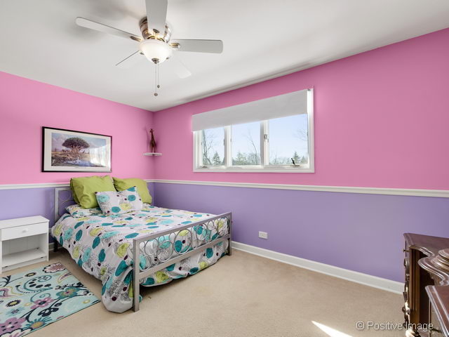 2S184 Sheffield Road Glen Ellyn, IL 60137 - Photo 20 of 25 a bedroom with a bed dresser and a window