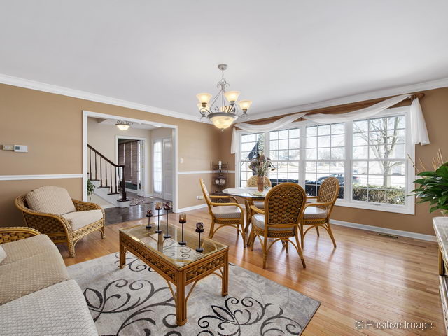 2S184 Sheffield Road Glen Ellyn, IL 60137 - Photo 3 of 25 a living room with furniture and wooden floor