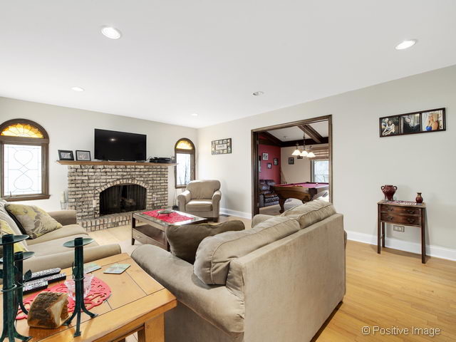 2S184 Sheffield Road Glen Ellyn, IL 60137 - Photo 6 of 25 a living room with furniture and a fireplace