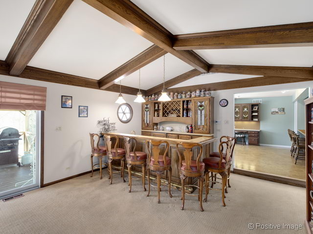 2S184 Sheffield Road Glen Ellyn, IL 60137 - Photo 8 of 25 a view of a dining area with furniture and chandelier