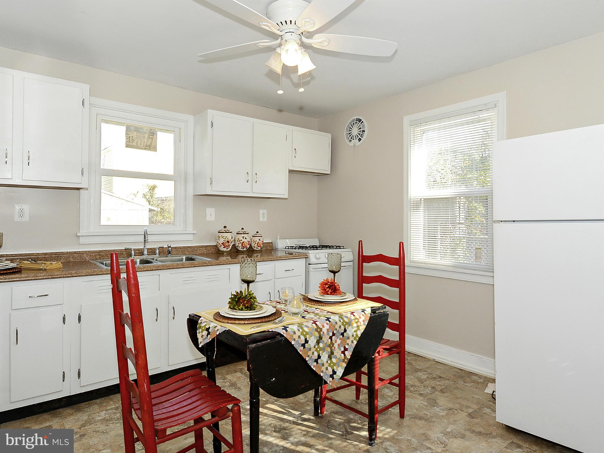 2721 Randolph Road Silver Spring, MD 20902 - Photo 5 of 25 a view of a dining room with furniture and a window