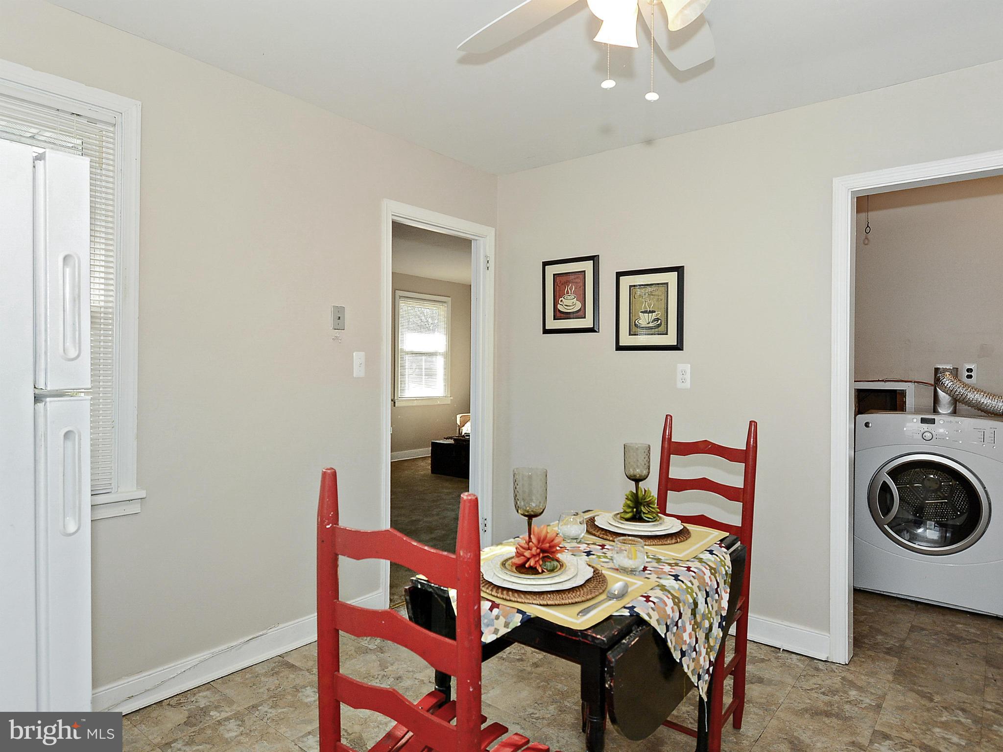 2721 Randolph Road Silver Spring, MD 20902 - Photo 6 of 25 a view of a dining room with furniture and wooden floor