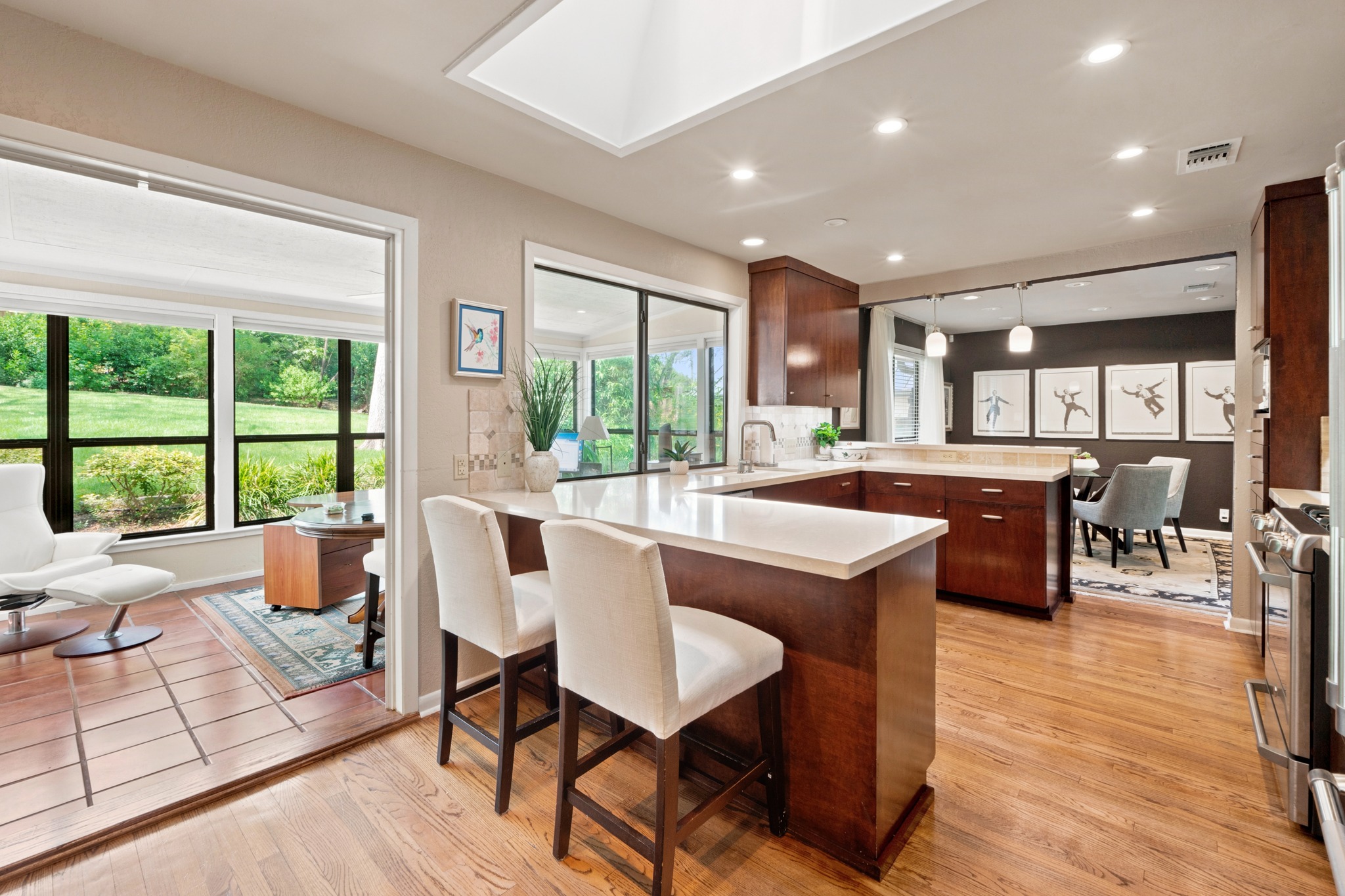 1904 Stoneridge Road Austin, TX 78746 - Photo 17 of 40 Breakfast bar and kitchen blend together beautifully with natural light and views to the outdoors.