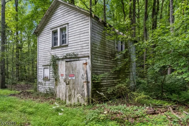 a view of a wooden door and a yard