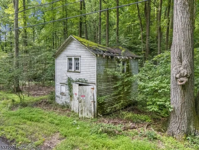 a house view with a backyard space