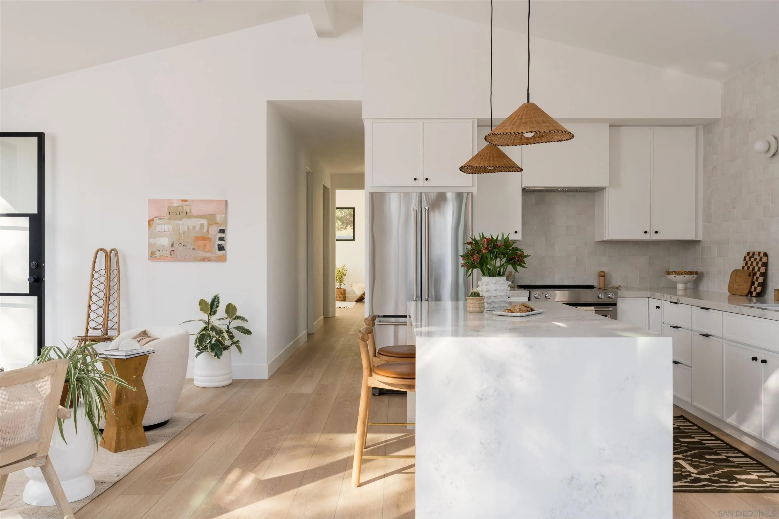 655 Lucylle Lane Encinitas, CA 92024 - Photo 4 of 23 a kitchen with stainless steel appliances granite countertop a refrigerator a sink a stove and white cabinets