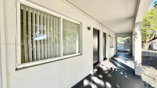 a view of balcony and wooden floor