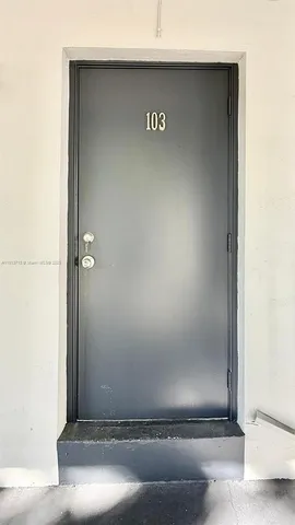 a view of a room with white walls