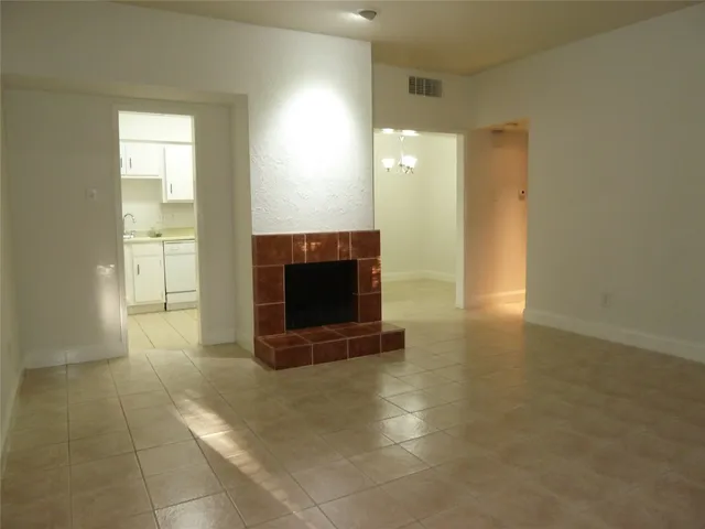 a view of fireplace and a hallway in a room