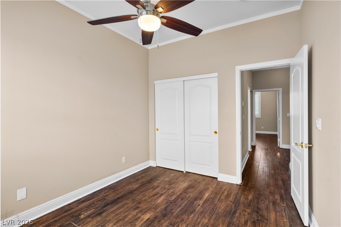 708 Vortex Avenue Henderson, NV 89002 - Photo 43 of 71 Rich hardwood-style flooring and a refreshing ceiling fan elevate this tranquil sleeping space.