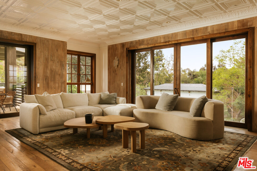 1105 Rivas Canyon Road Pacific Palisades, CA 90272 - Photo 12 of 49 a living room with furniture and a large window