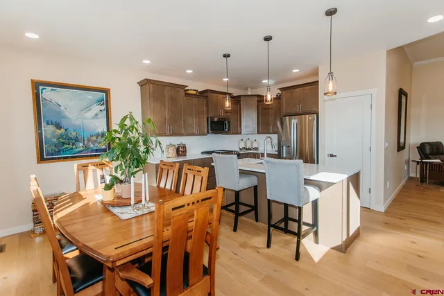 a dining room with furniture and window
