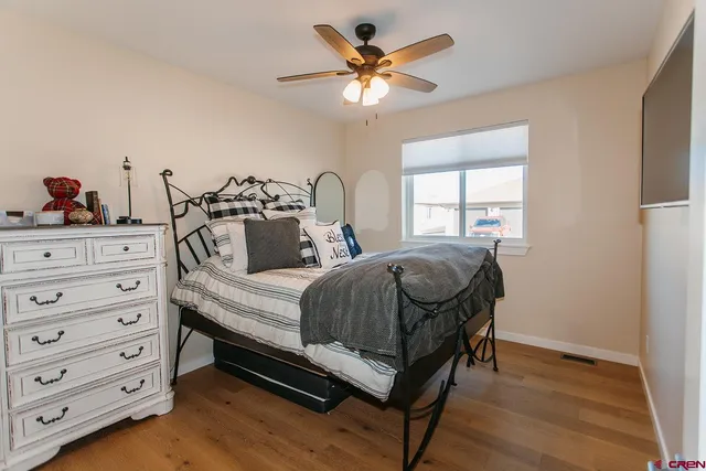 a bedroom with a bed and a dresser