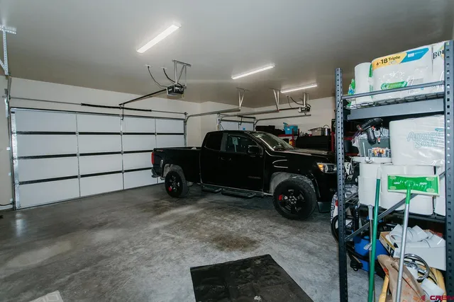 a view of a garage with parked cars