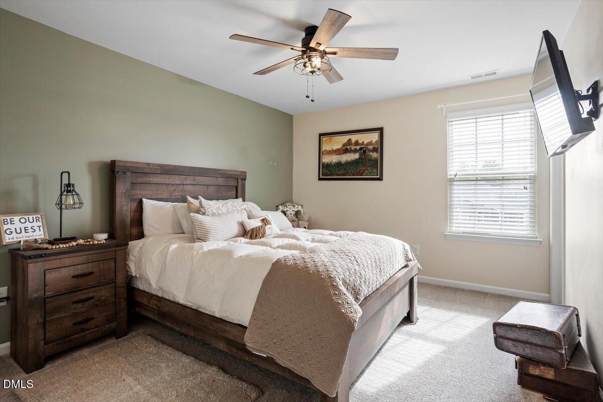205 Battery Way Bunnlevel, NC 28323 - Photo 33 of 37 a bedroom with bed and a window