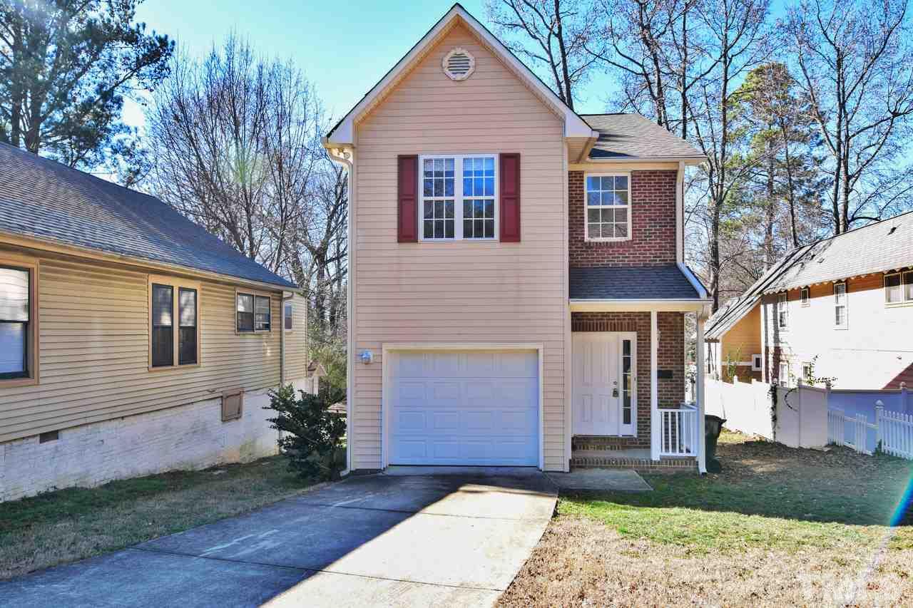 702 Method Road Raleigh, NC 27607 - Photo 1 of 25 a front view of a house with a yard