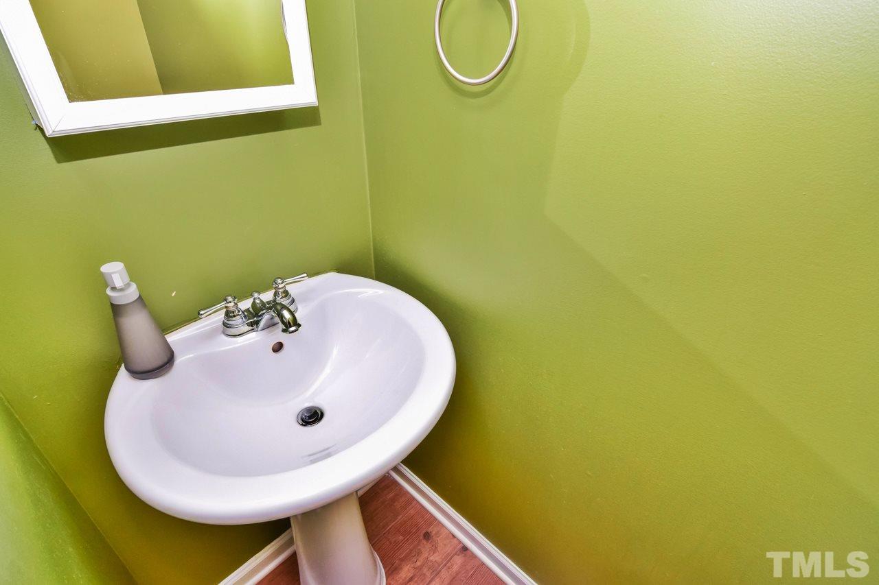 702 Method Road Raleigh, NC 27607 - Photo 11 of 25 a bathroom with a sink and a mirror