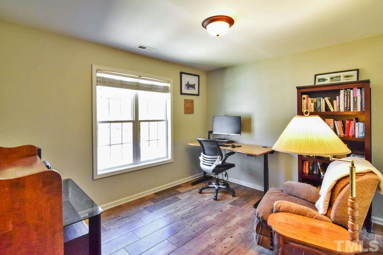 702 Method Road Raleigh, NC 27607 - Photo 17 of 25 a living room with furniture and a window