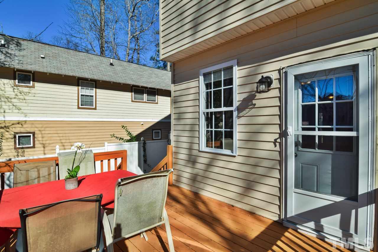 702 Method Road Raleigh, NC 27607 - Photo 21 of 25 a view of a house with a balcony and door