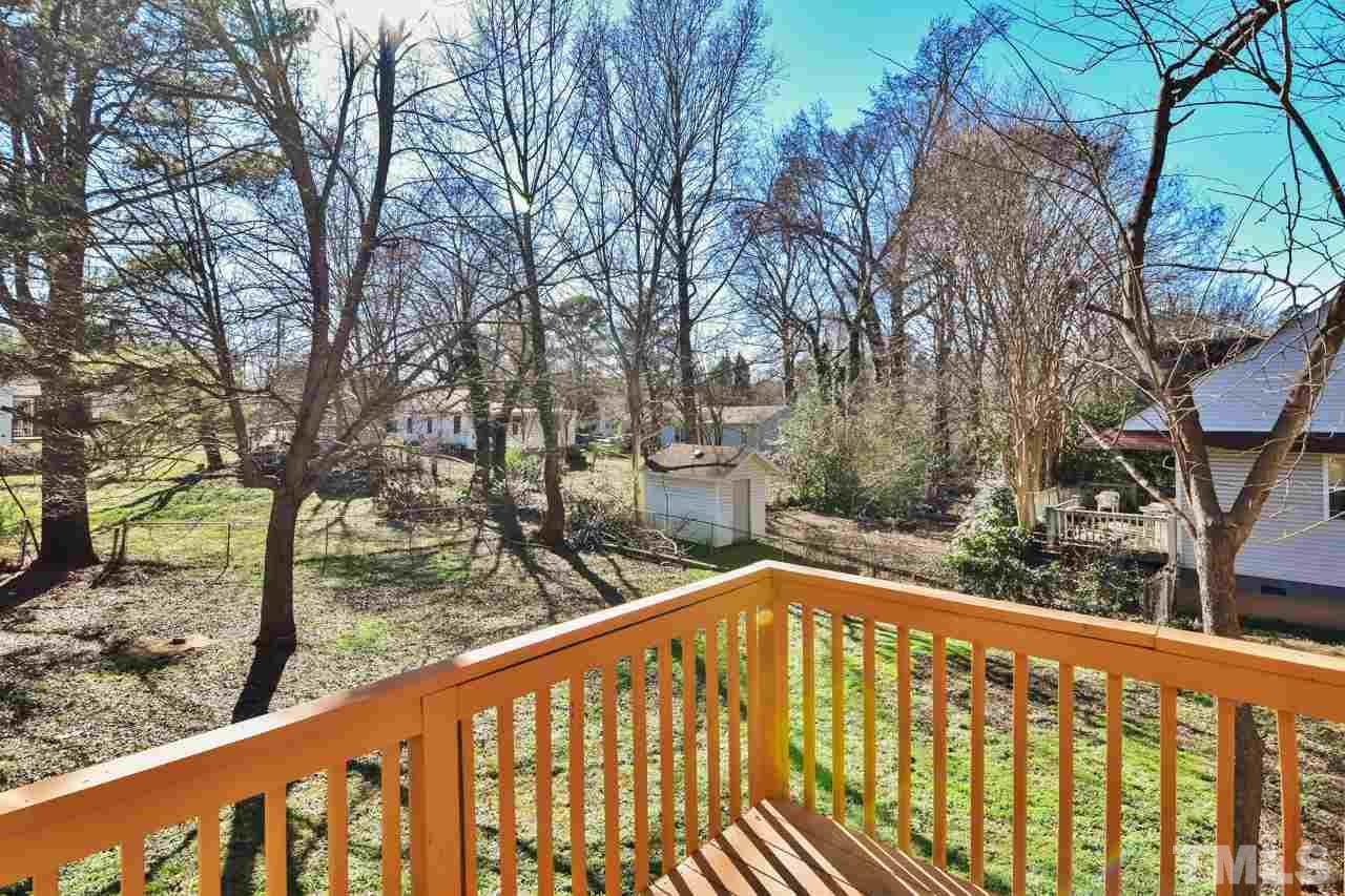 702 Method Road Raleigh, NC 27607 - Photo 22 of 25 a view of a balcony with trees