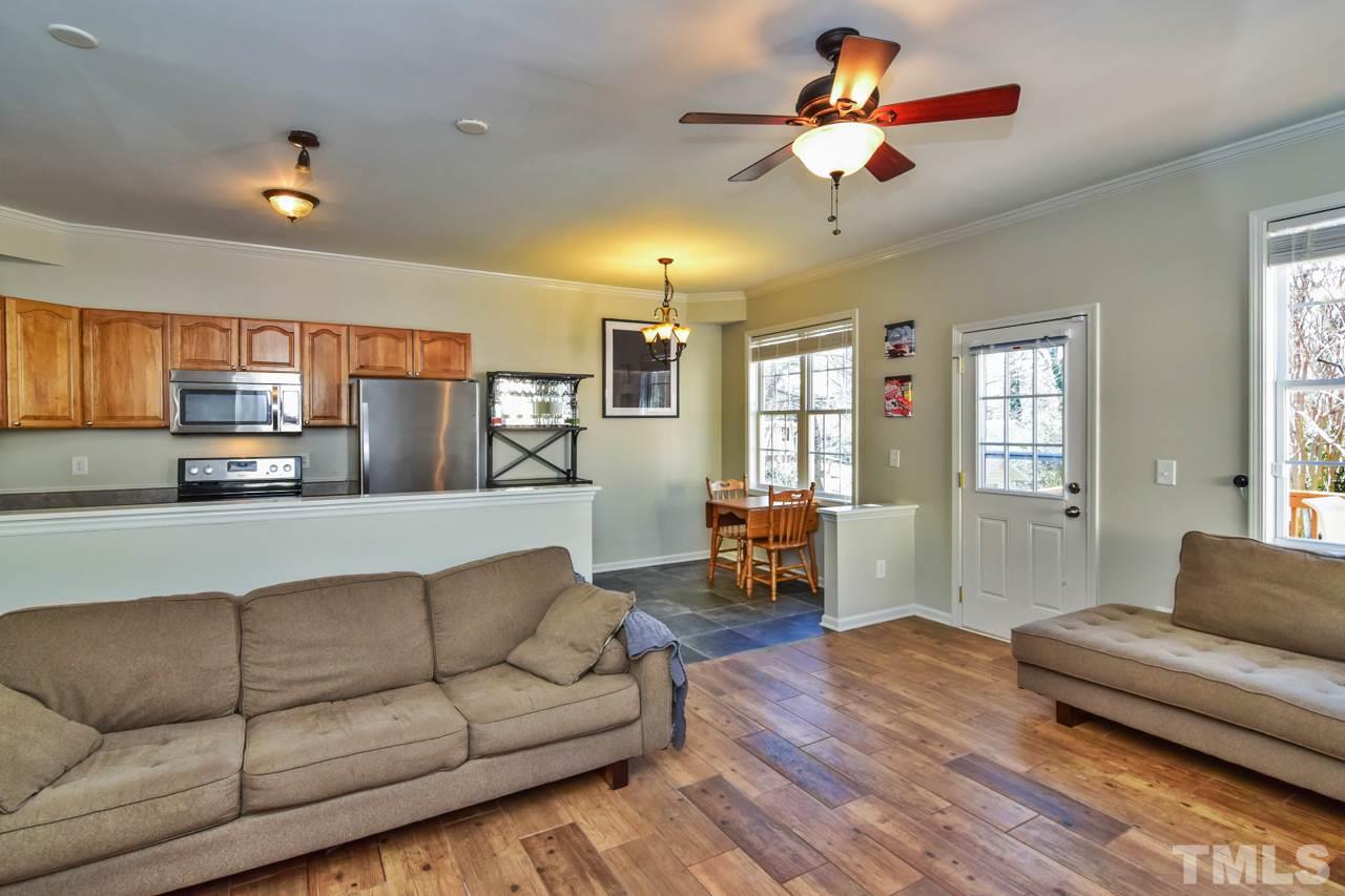702 Method Road Raleigh, NC 27607 - Photo 6 of 25 a living room with furniture and a couch