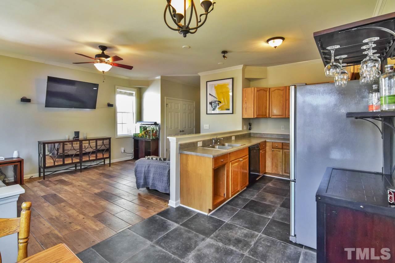 702 Method Road Raleigh, NC 27607 - Photo 8 of 25 a kitchen with stainless steel appliances granite countertop a sink and cabinets
