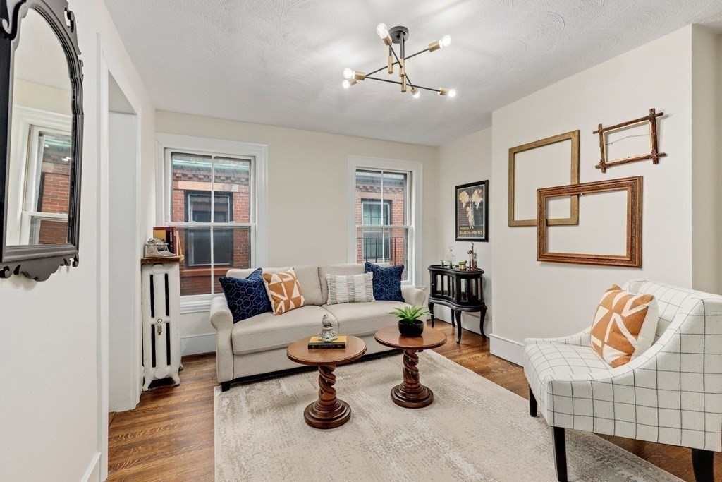 2 Goodwin Place, Unit 3 Boston, MA 02114 - Photo 11 of 28 a living room with furniture