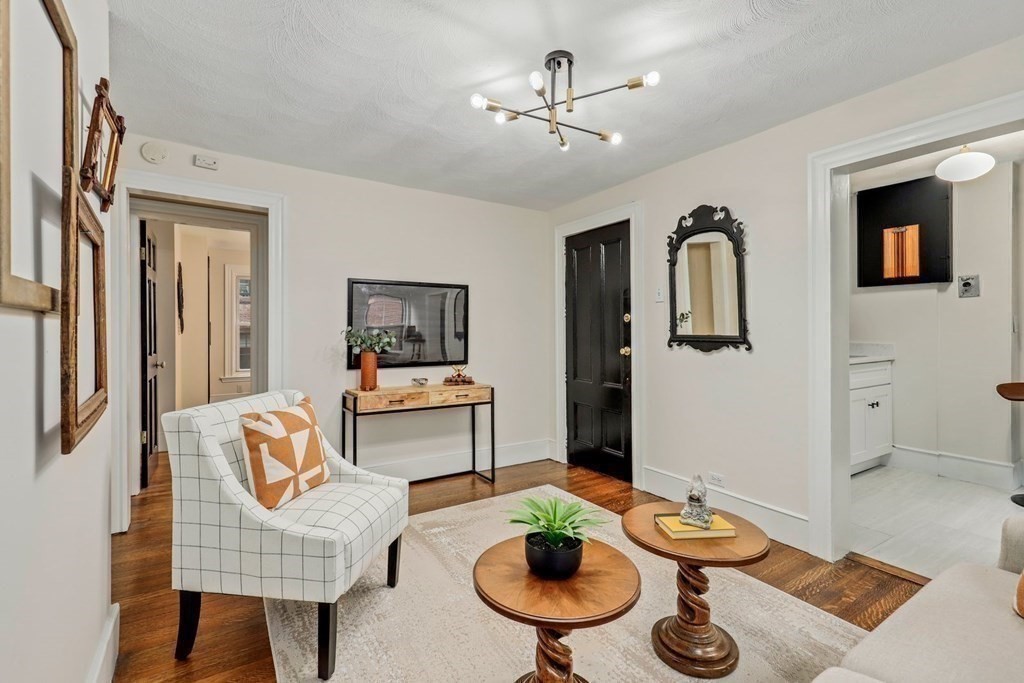 2 Goodwin Place, Unit 3 Boston, MA 02114 - Photo 14 of 28 a living room with furniture and a wooden floor