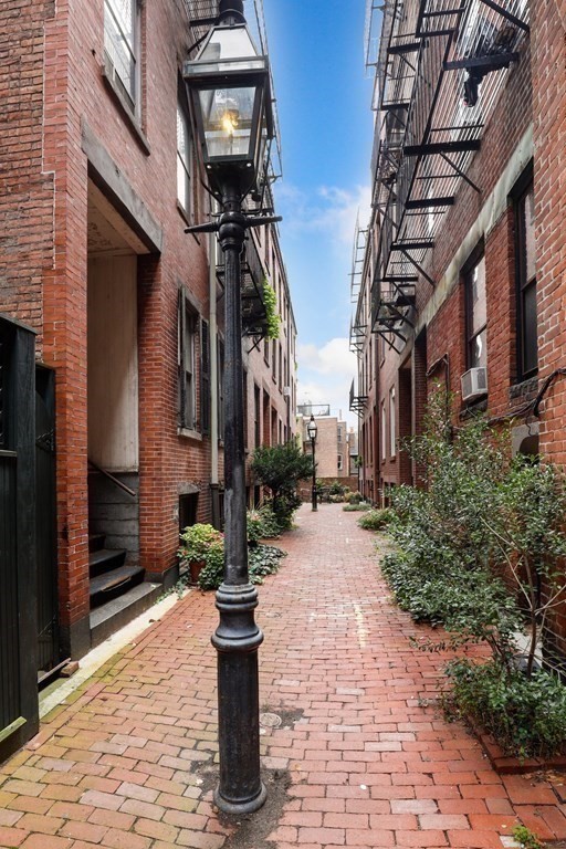 2 Goodwin Place, Unit 3 Boston, MA 02114 - Photo 3 of 28 a view of a pathway that has the both side of house
