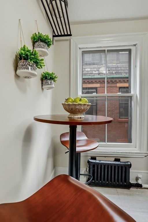 2 Goodwin Place, Unit 3 Boston, MA 02114 - Photo 6 of 28 a bedroom with a bed and a potted plant