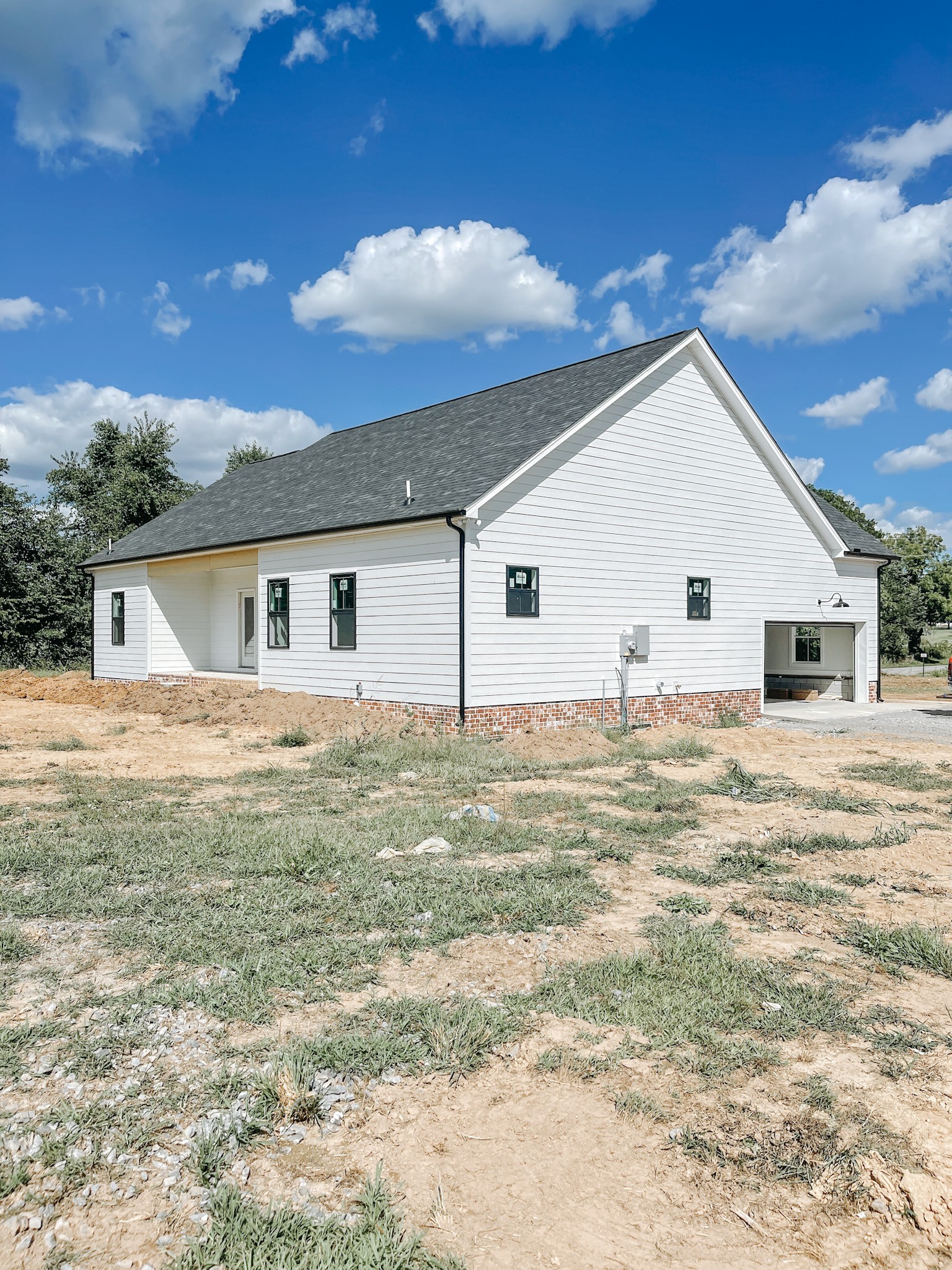 251 Tom Ferrell Road Portland, TN 37148 - Photo 2 of 7 a view of a white house with a yard
