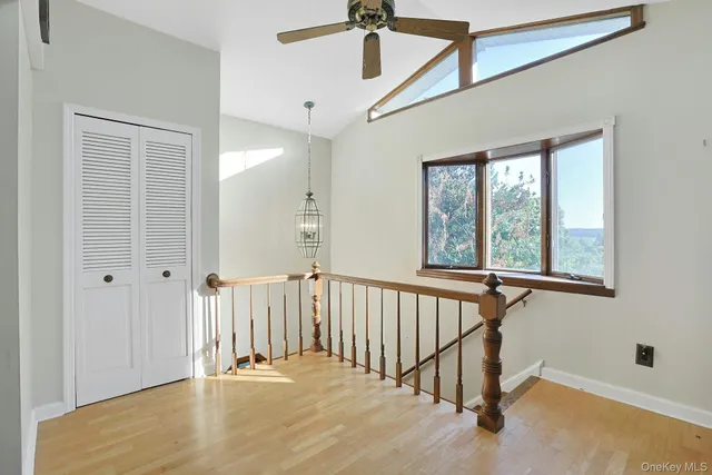 a view of an entryway with wooden floor