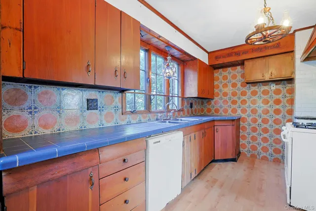 a kitchen with stainless steel appliances granite countertop a sink and cabinets