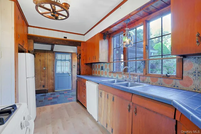 a kitchen with a sink and a window