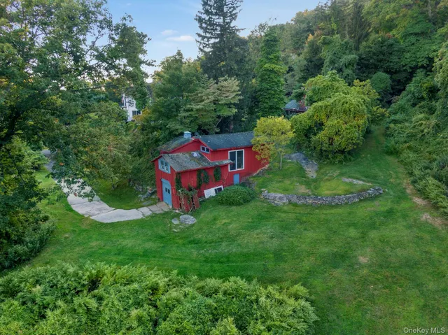 a view of a garden with a house