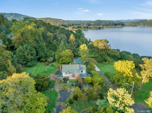 an aerial view of a house with a lake view